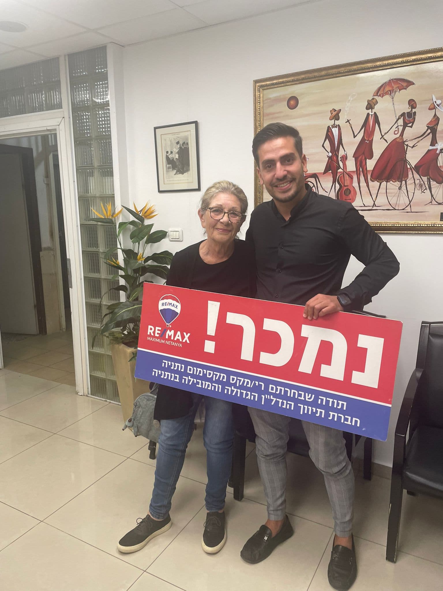 Omer with happy client - sold!